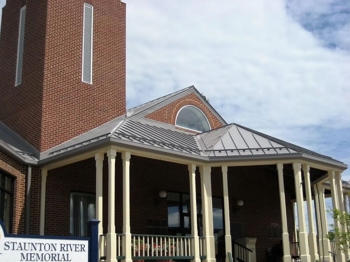 Skilled roofing craftsmen working on a residential roof in Erie